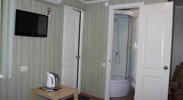 Фото номера Классический четырёхместный номер Гостевой дом Rostovskaya 181 Inn г. Ейск 7