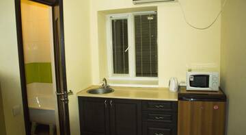 Фото номера Четырехместный номер Гостиница Guest House Morskaya 265 г. Ейск 5